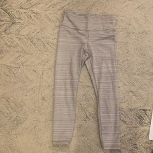 Athleta 7/8 yoga leggings in grey/taupe.